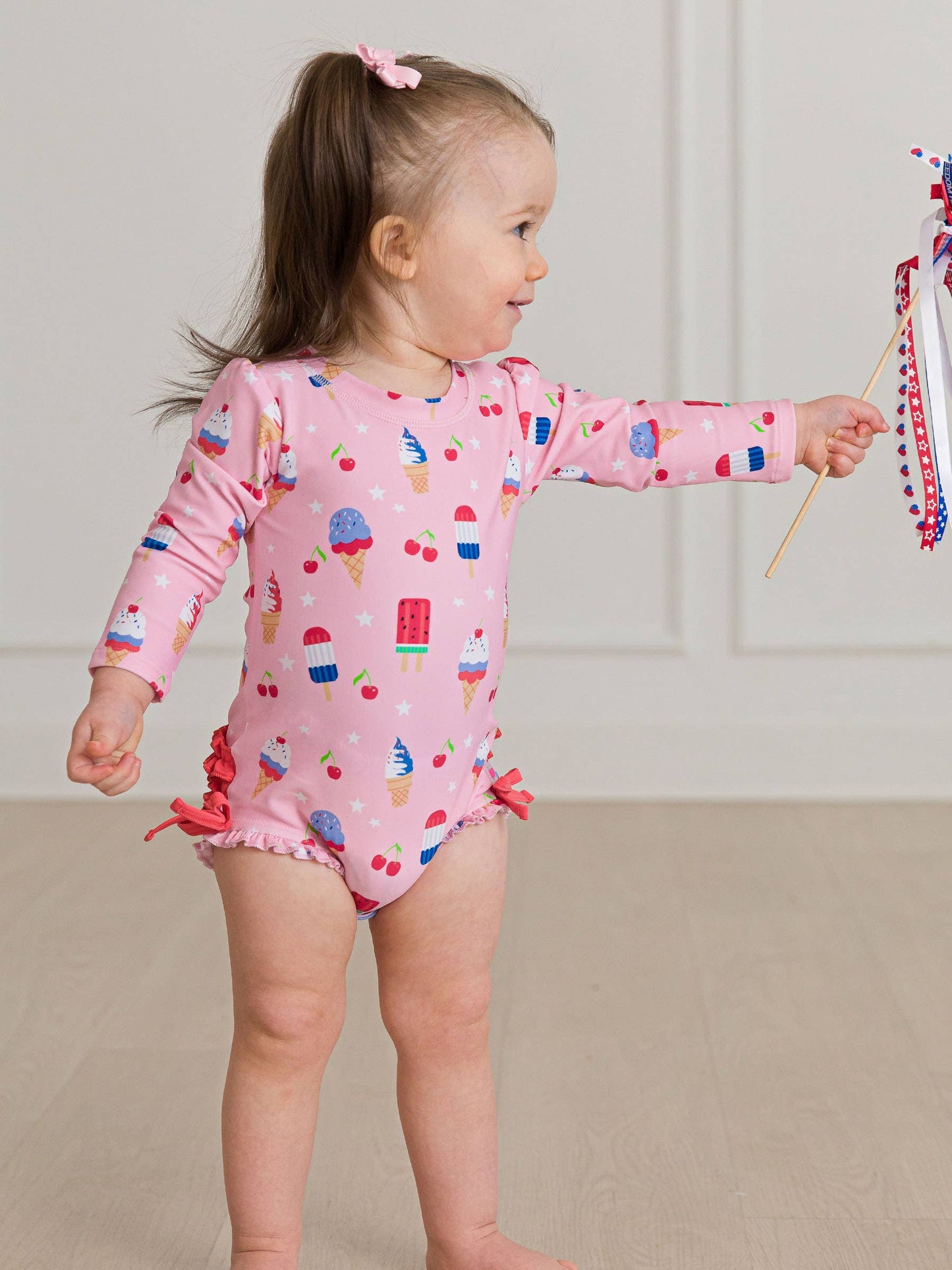 Baby Girls Sweet Freedom Long Sleeve One Piece Rash Guard Swimsuit with Signature Rear Ruffles